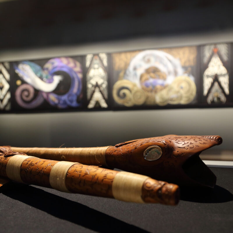 Carved taonga puoro and paintings
